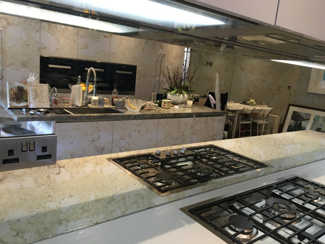 Mirror glass splashback in Banstead luxury kitchen