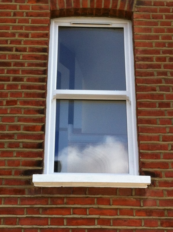 uPVC sash window on Victorian red brick house in Banstead